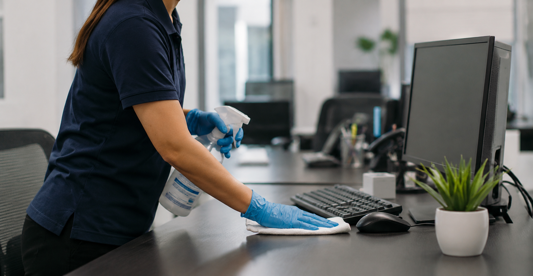 Professional cleaner carefully sanitizing a South Florida office